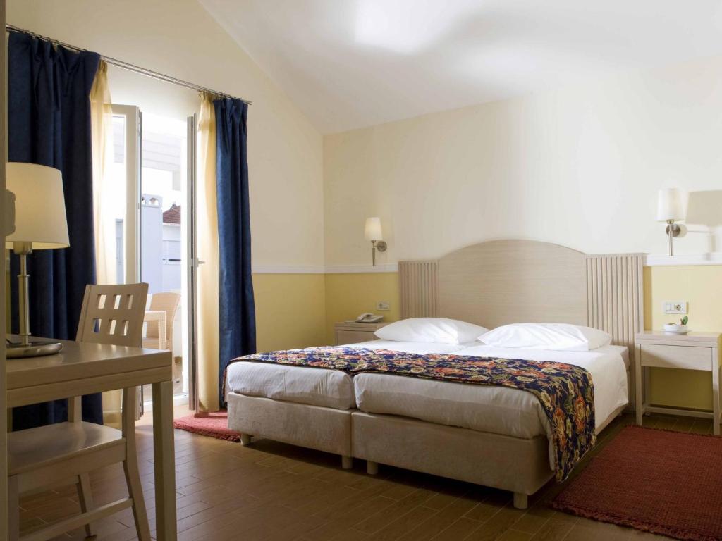 Posteľ alebo postele v izbe v ubytovaní Amadria Park Apartments Šibenik