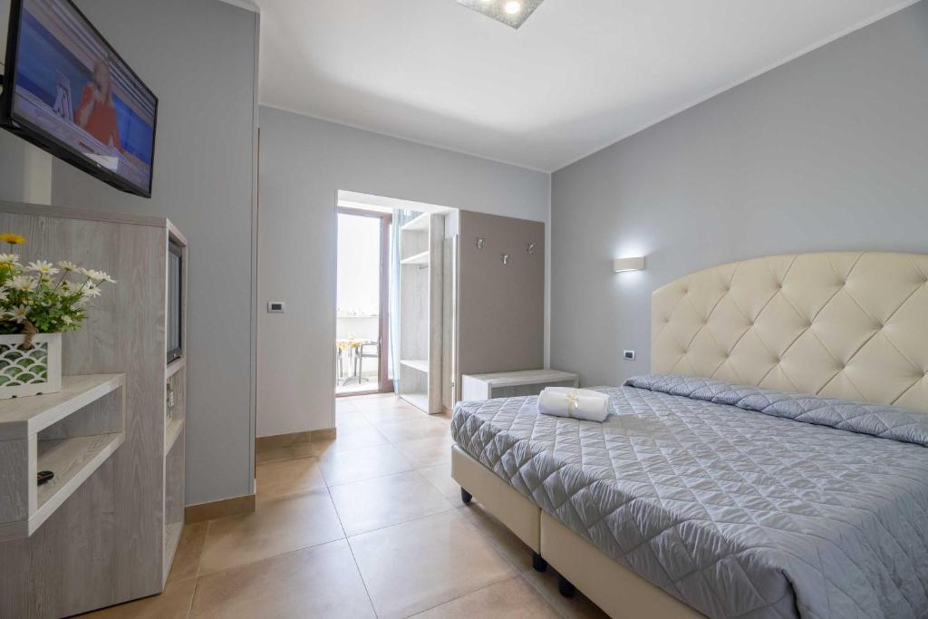 Postel nebo postele na pokoji v ubytování Hotel Salento Mirfran