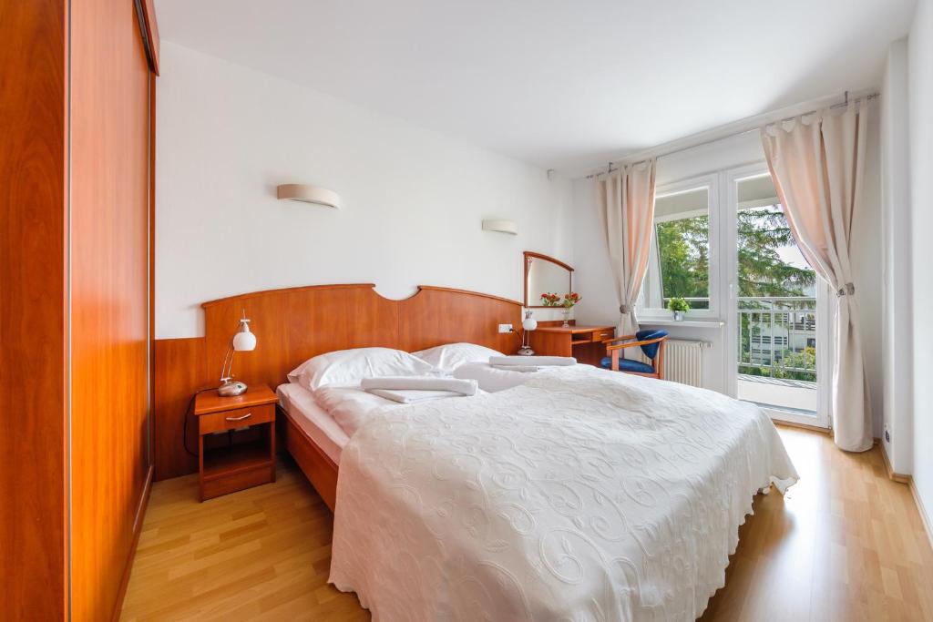 Posteľ alebo postele v izbe v ubytovaní Apartamenty Sun & Snow w Rezydencji Bielik