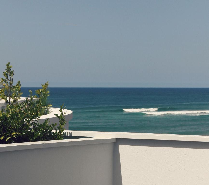 a view of the ocean from a balcony at Le Grand Hotel de la Plage in Biscarrosse-Plage