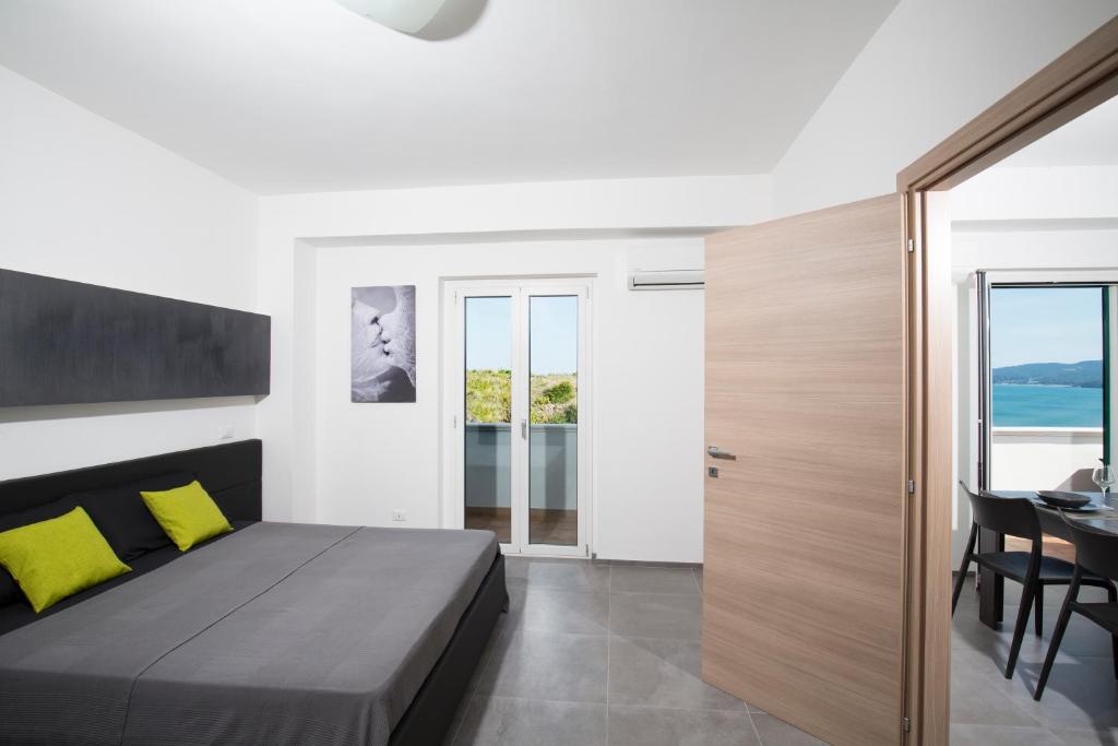 Posteľ alebo postele v izbe v ubytovaní Svevo Sea House