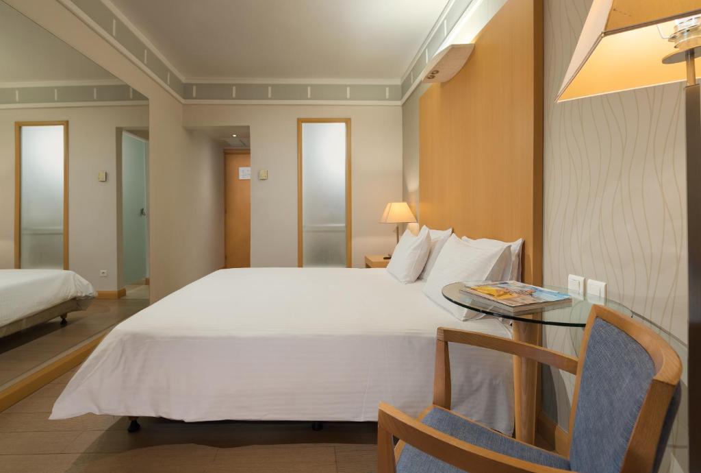 Postel nebo postele na pokoji v ubytování Central Hotel