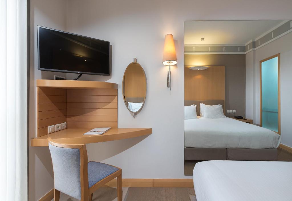 Postel nebo postele na pokoji v ubytování Central Hotel