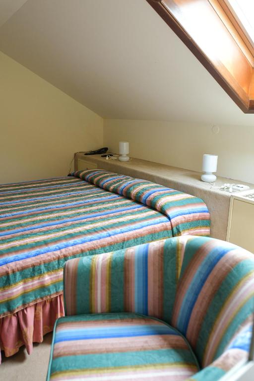Postel nebo postele na pokoji v ubytování Hotel Elite