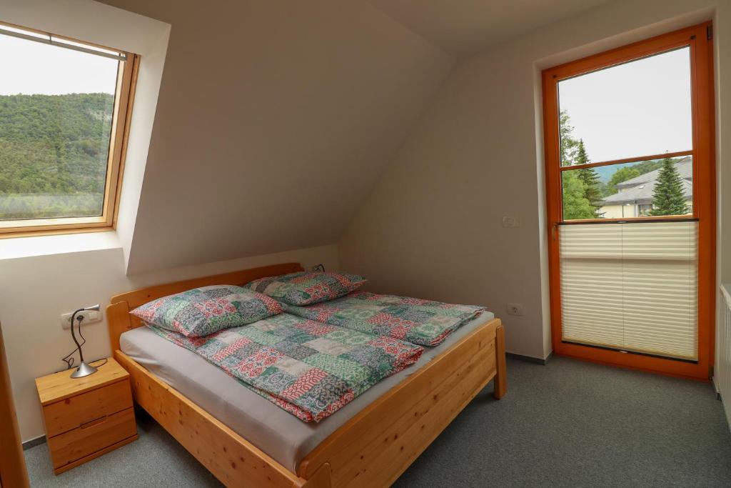 Postel nebo postele na pokoji v ubytování Apartments & Rooms Pr' Skalovc