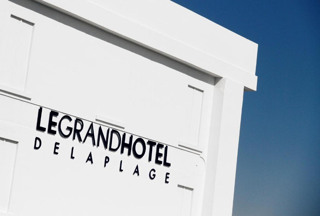 a sign that reads leanderhold prevalence on a building at Le Grand Hotel de la Plage in Biscarrosse-Plage