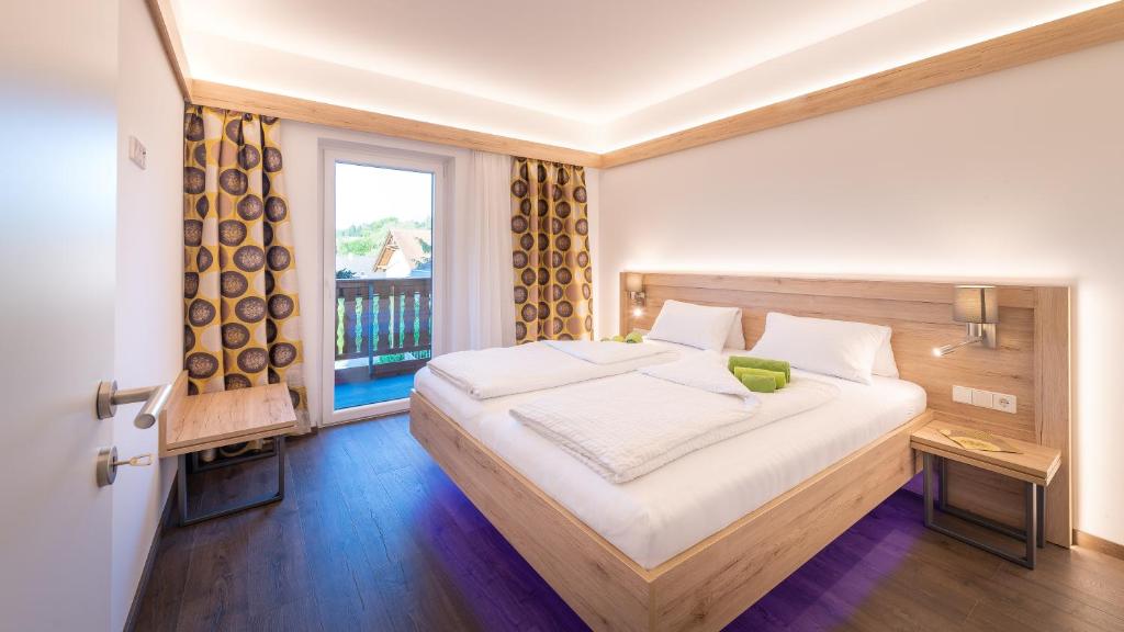 Posteľ alebo postele v izbe v ubytovaní Apartments Presslauer - Mori