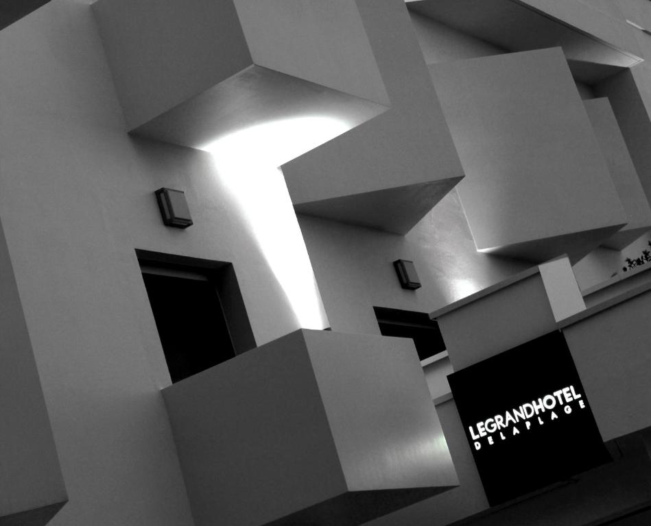a view of a building with a light on the wall at Le Grand Hotel de la Plage in Biscarrosse-Plage
