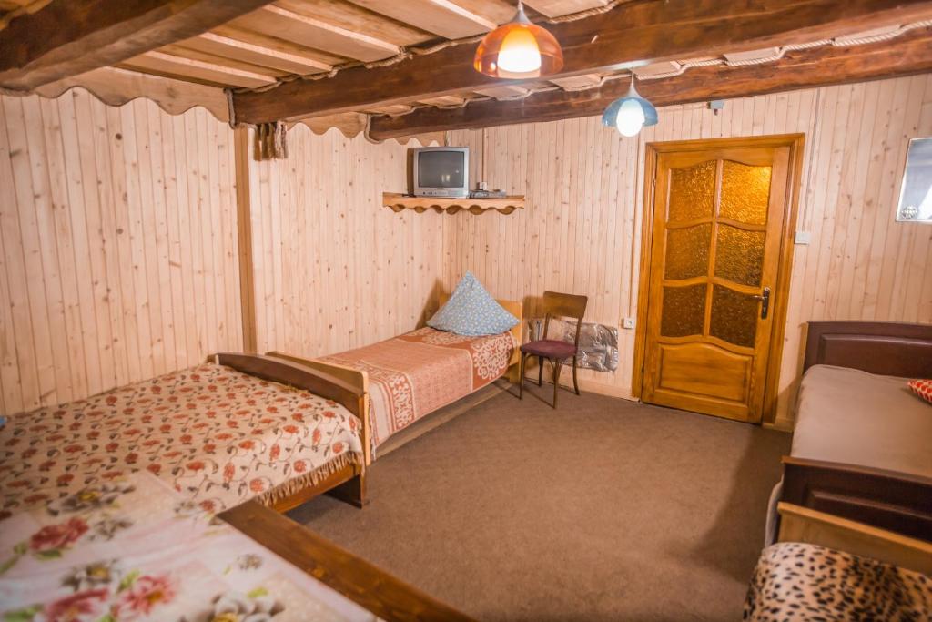 Postel nebo postele na pokoji v ubytování Садиба над потоком