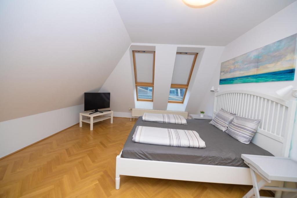 Łóżko lub łóżka w pokoju w obiekcie Vienna Hotspot