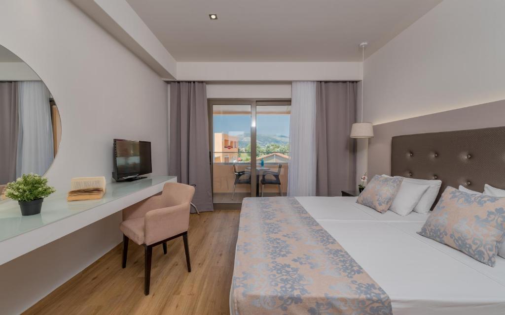 Postel nebo postele na pokoji v ubytování Oscar Hotel