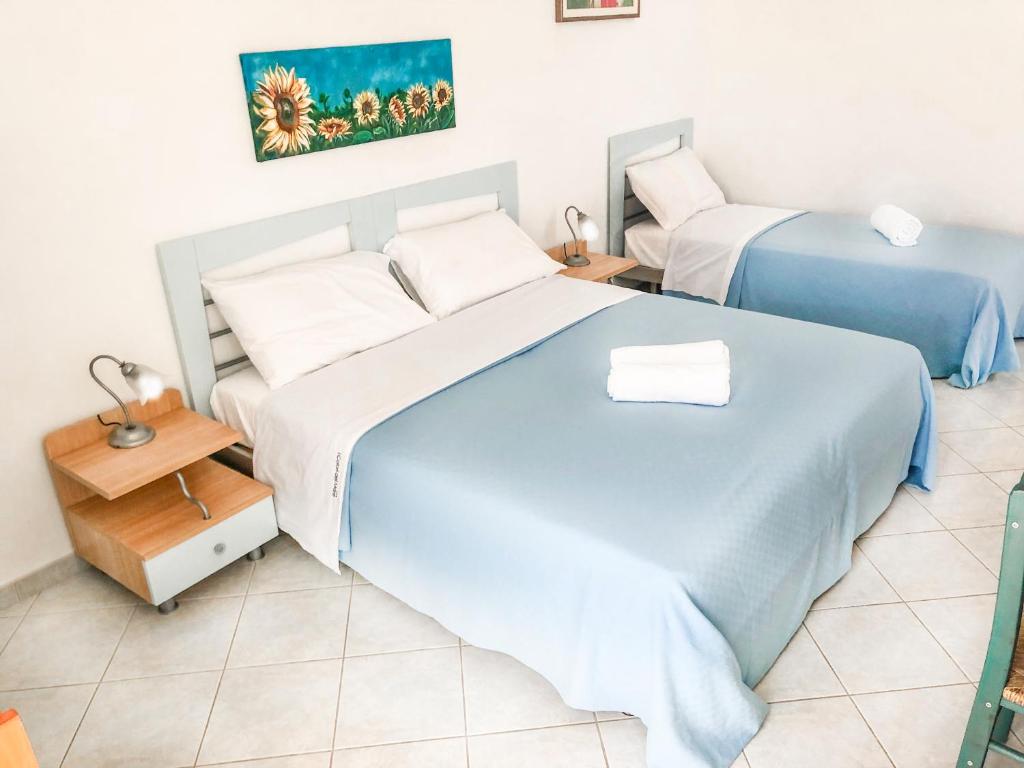 Postel nebo postele na pokoji v ubytování Hotel I Colori Del Mare