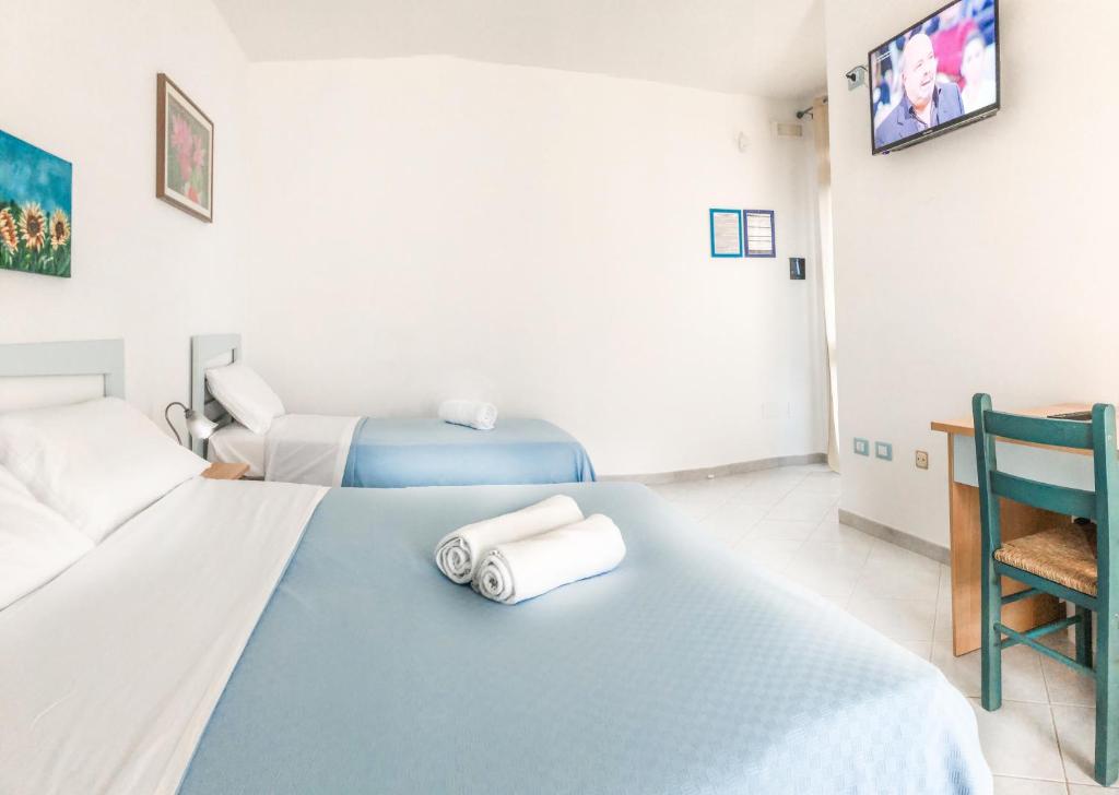 Postel nebo postele na pokoji v ubytování Hotel I Colori Del Mare