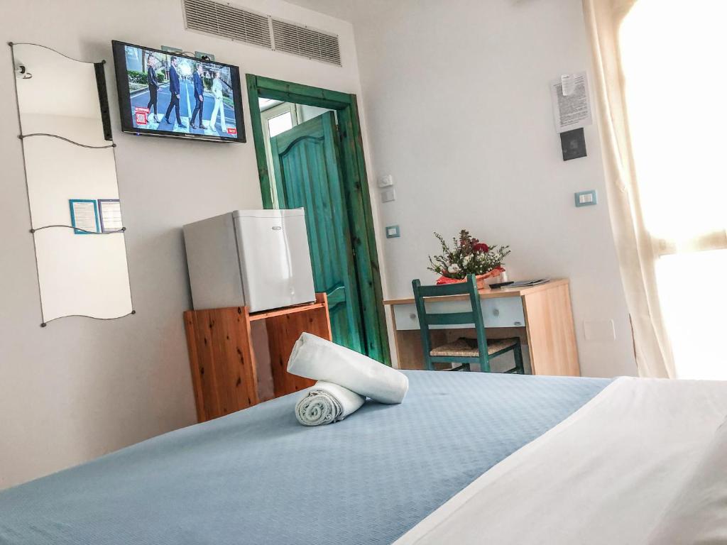 Postel nebo postele na pokoji v ubytování Hotel I Colori Del Mare