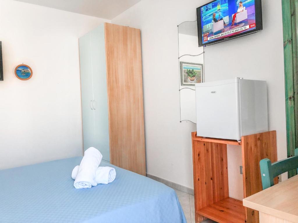 Postel nebo postele na pokoji v ubytování Hotel I Colori Del Mare
