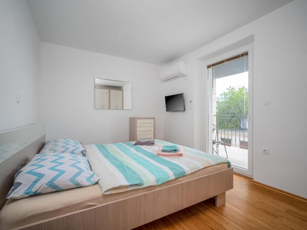 Postel nebo postele na pokoji v ubytování Holiday Home Mario 2 by Interhome