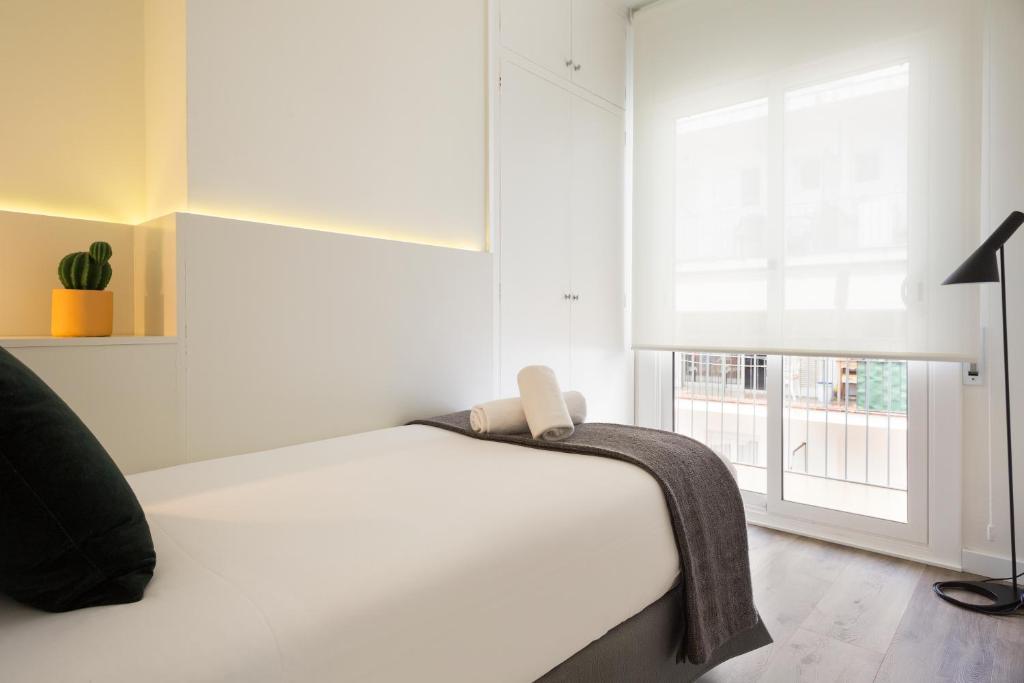 A bed or beds in a room at Sitges Group Calm Beach
