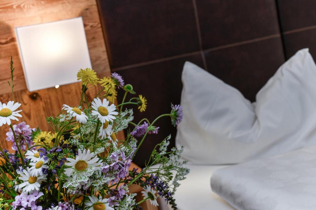 Postel nebo postele na pokoji v ubytování Hotel Brunella