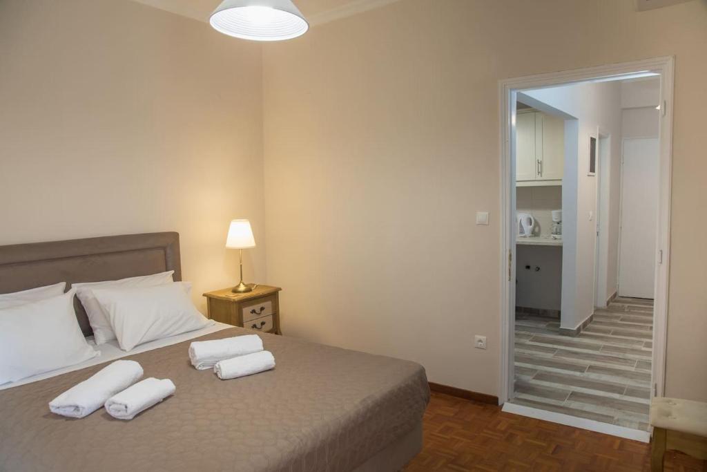 A bed or beds in a room at Cherry Apartment Corfu