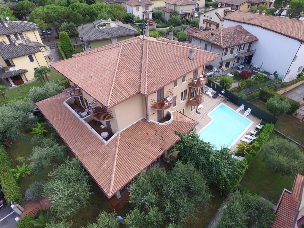 an aerial view of a house with a swimming pool at Hotel Chiara in Sirmione