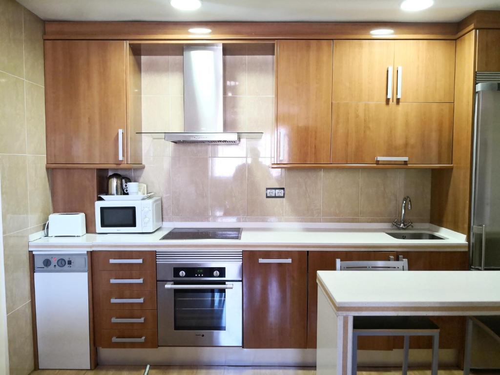 Una cocina o zona de cocina en Apartamentos Cocó