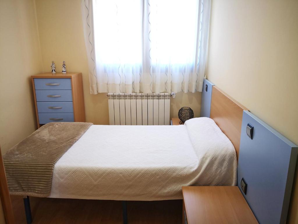 Cama o camas de una habitación en Apartamentos Cocó