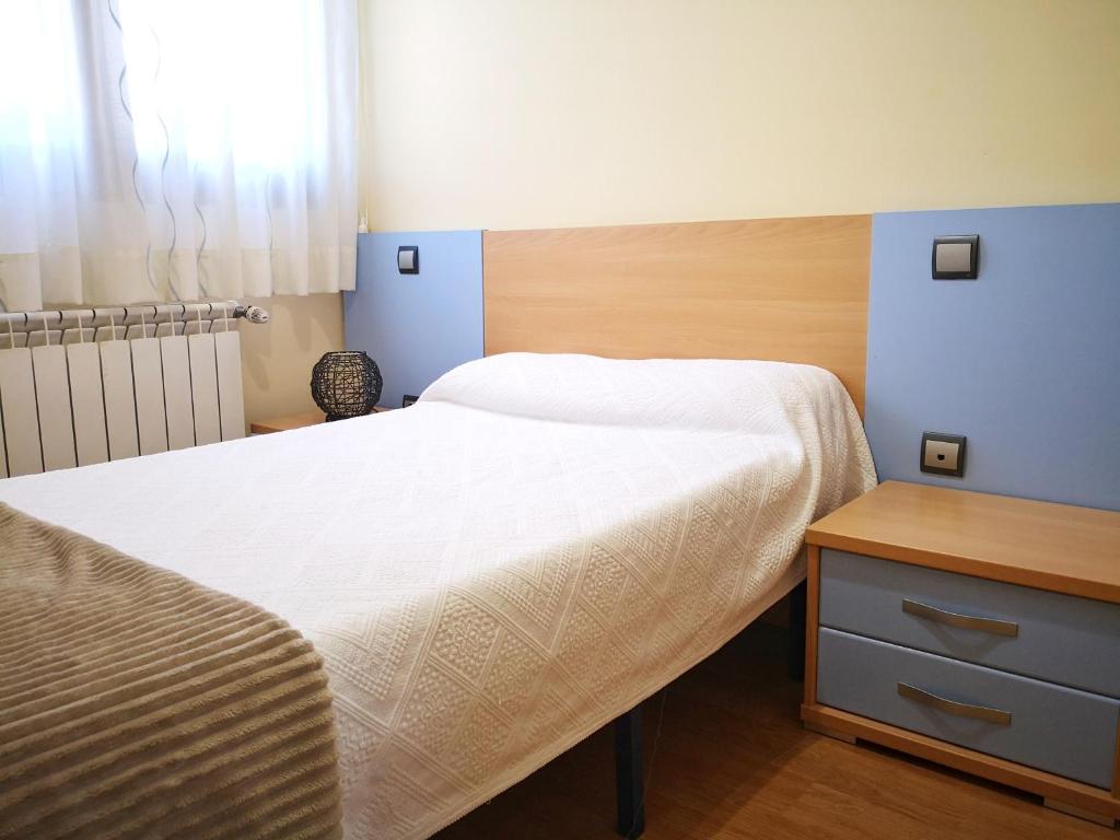 Cama o camas de una habitación en Apartamentos Cocó