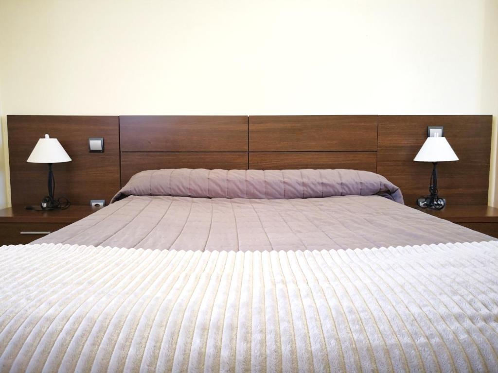 Cama o camas de una habitación en Apartamentos Cocó