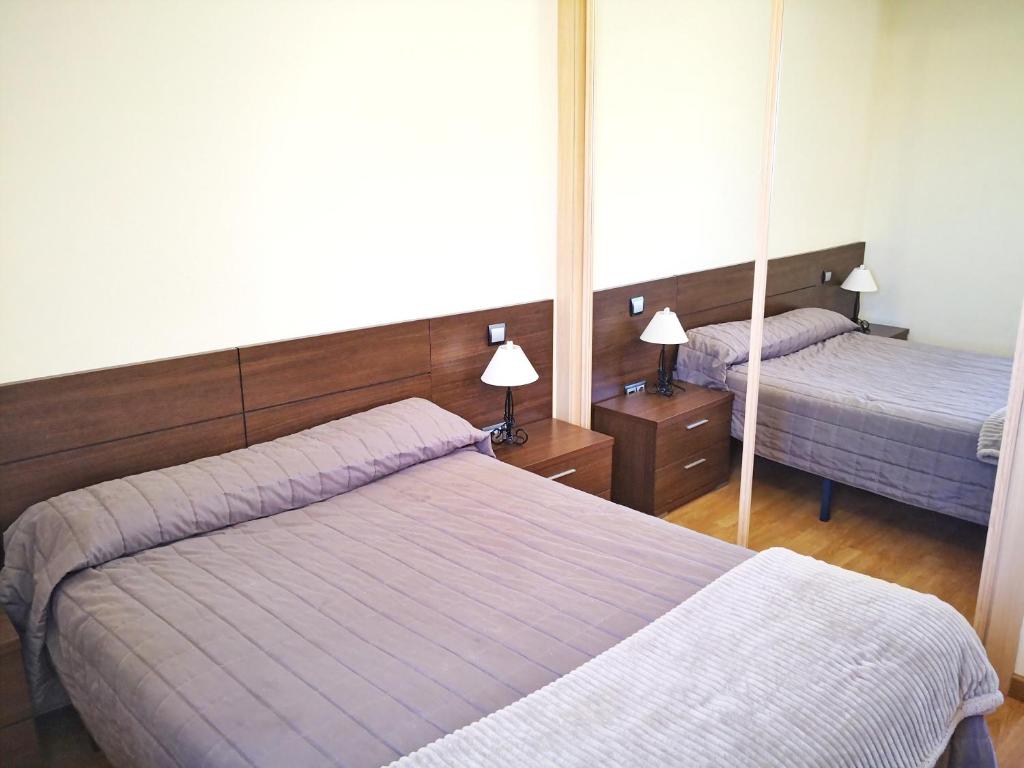 Cama o camas de una habitación en Apartamentos Cocó