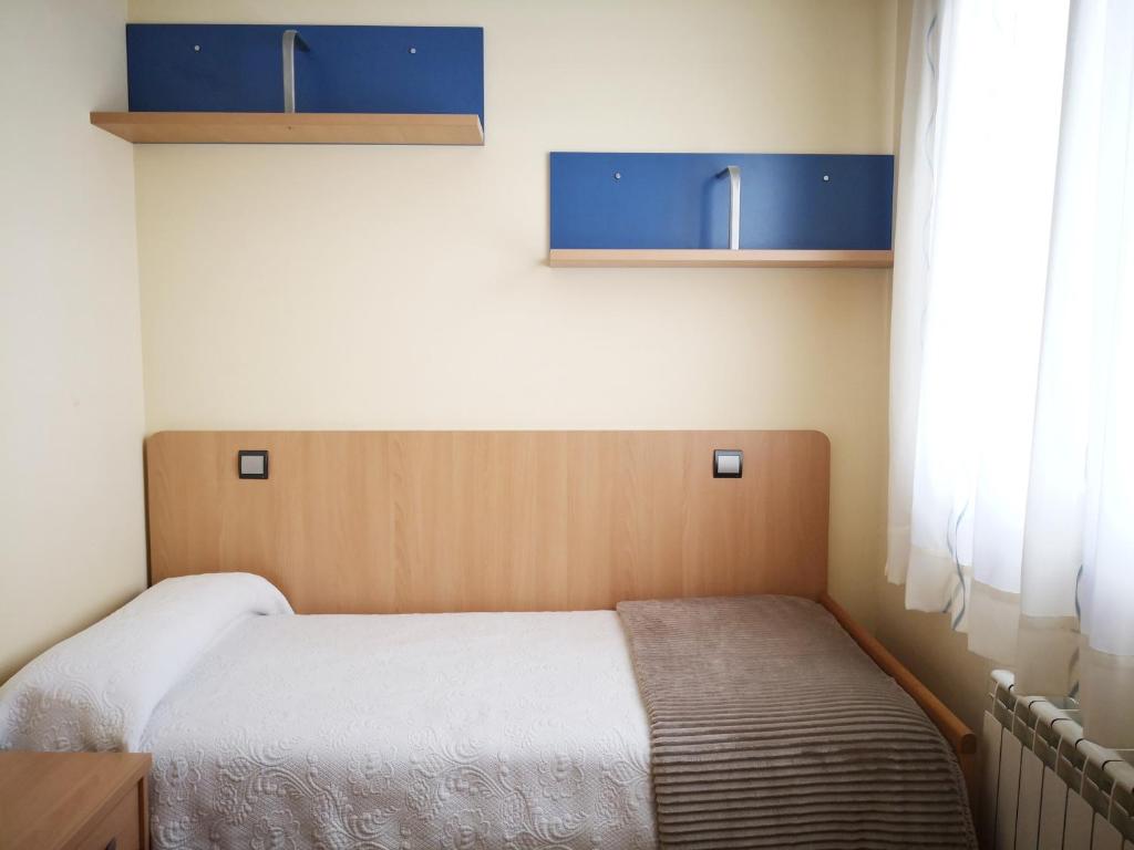 Cama o camas de una habitación en Apartamentos Cocó