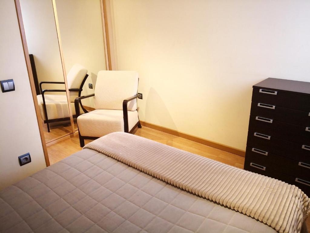 Cama o camas de una habitación en Apartamentos Cocó
