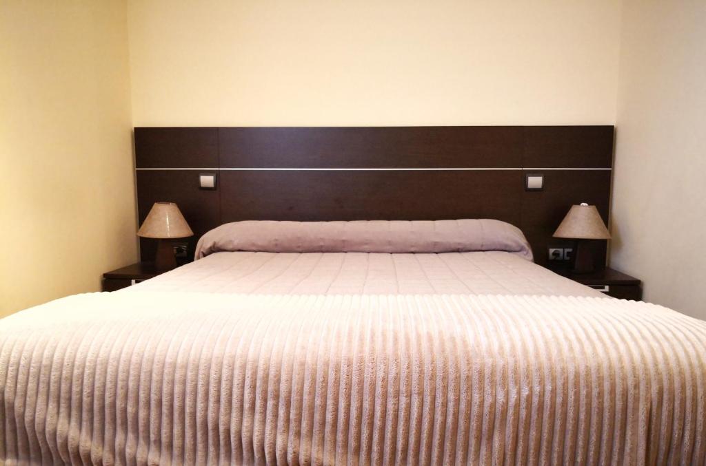 Cama o camas de una habitación en Apartamentos Cocó