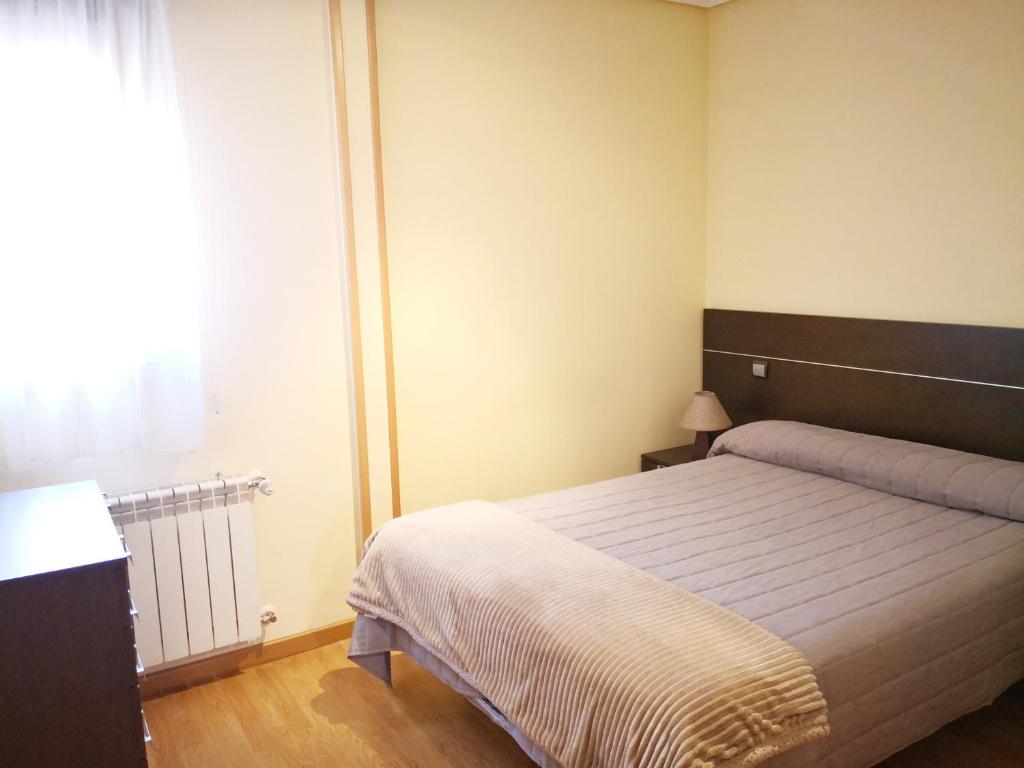 Cama o camas de una habitación en Apartamentos Cocó