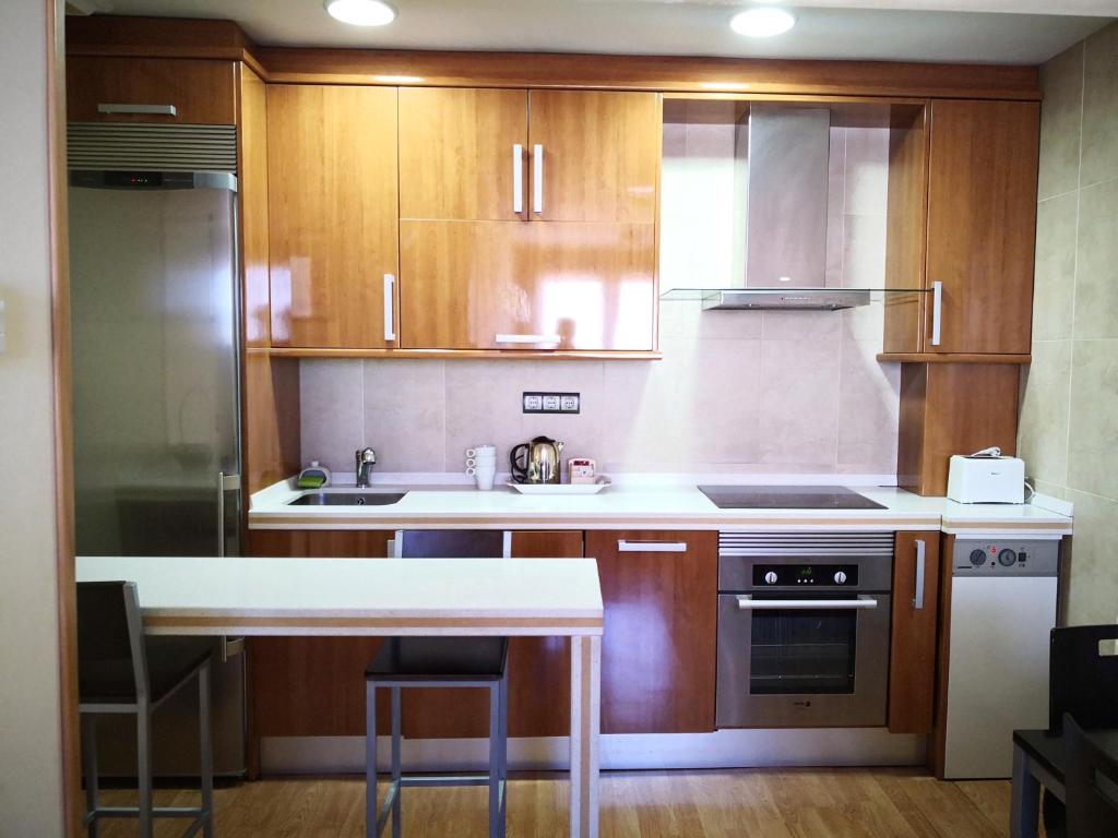 Una cocina o zona de cocina en Apartamentos Cocó
