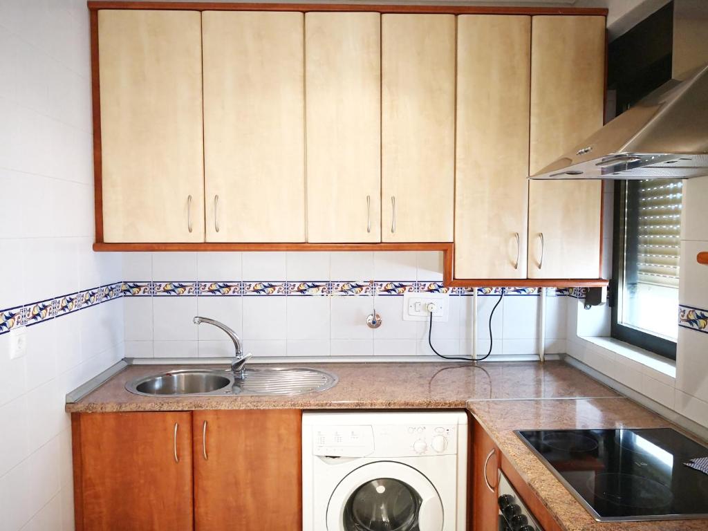 Una cocina o zona de cocina en Apartamentos Cocó