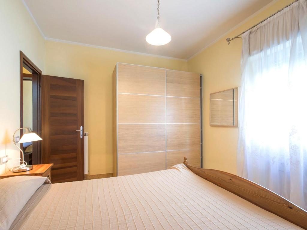 Łóżko lub łóżka w pokoju w obiekcie Apartment Il Litorale by Interhome