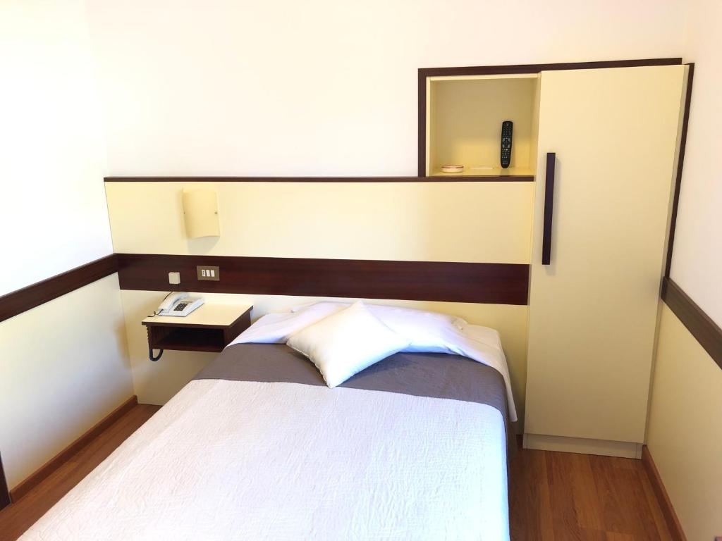Postel nebo postele na pokoji v ubytování Hotel Signa