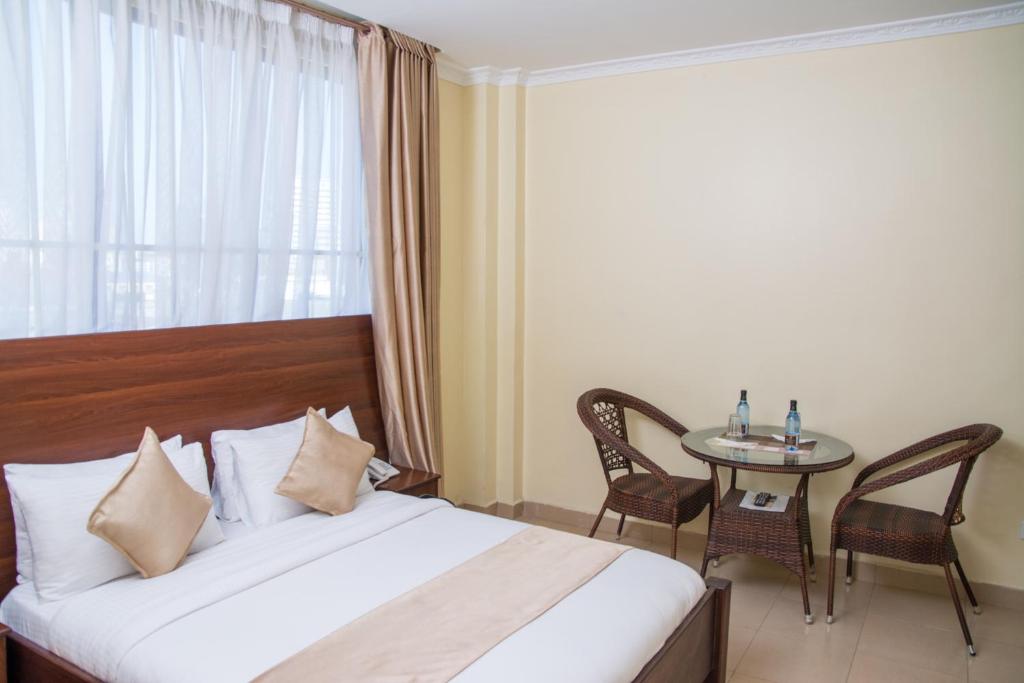 Postel nebo postele na pokoji v ubytování Delfirm Hotel