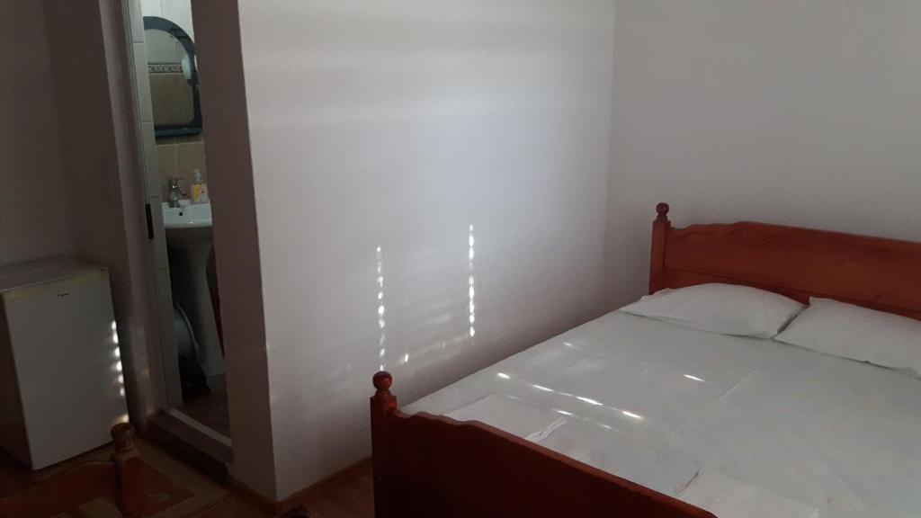 Postel nebo postele na pokoji v ubytování Guesthouse Sinani