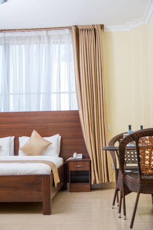 Postel nebo postele na pokoji v ubytování Delfirm Hotel