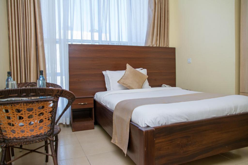 Postel nebo postele na pokoji v ubytování Delfirm Hotel