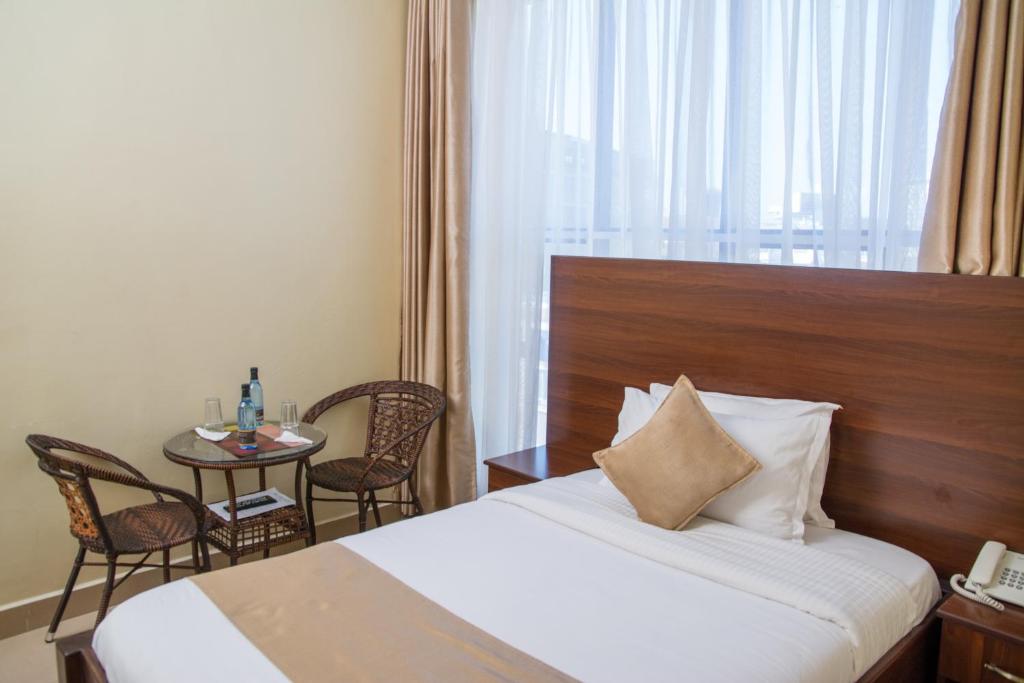 Postel nebo postele na pokoji v ubytování Delfirm Hotel
