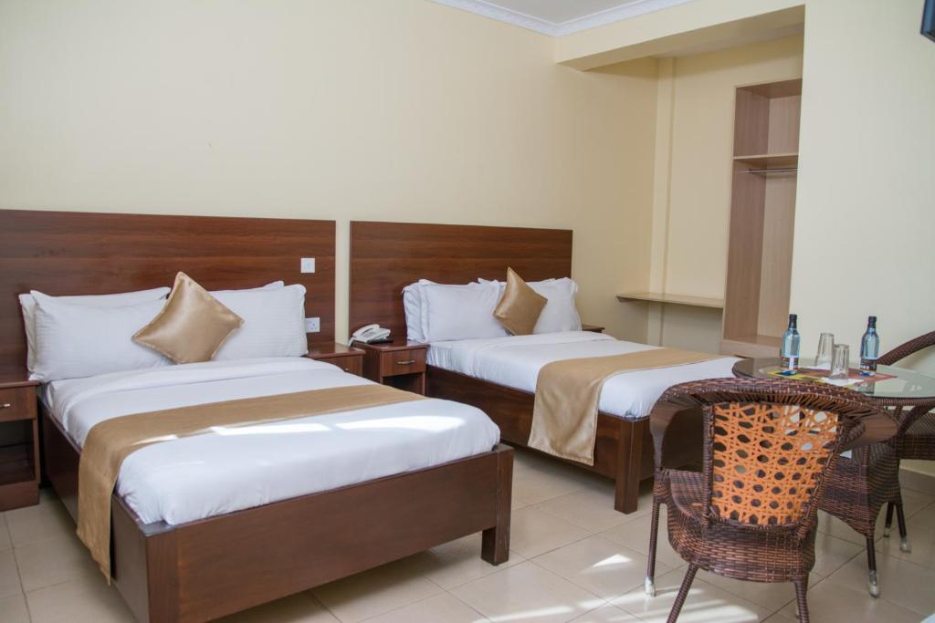 Postel nebo postele na pokoji v ubytování Delfirm Hotel