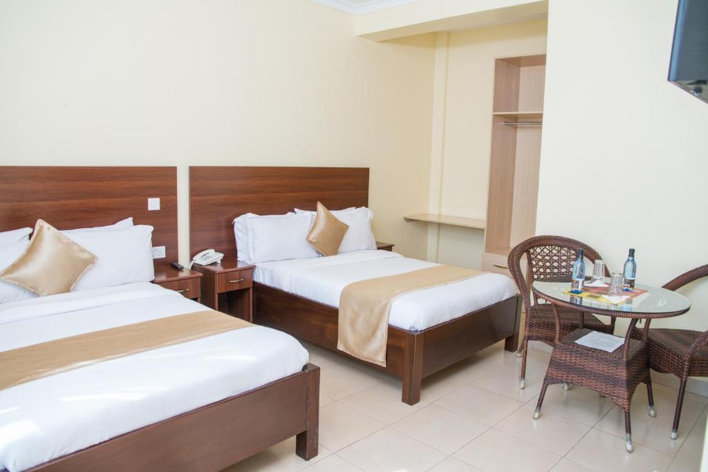 Postel nebo postele na pokoji v ubytování Delfirm Hotel