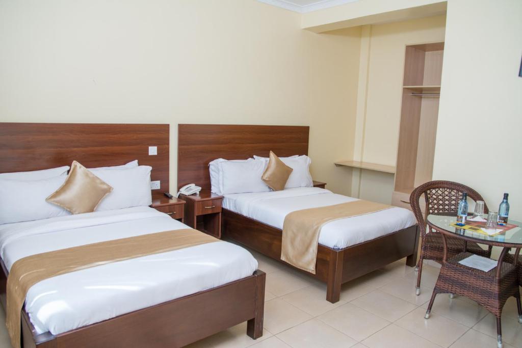 Postel nebo postele na pokoji v ubytování Delfirm Hotel