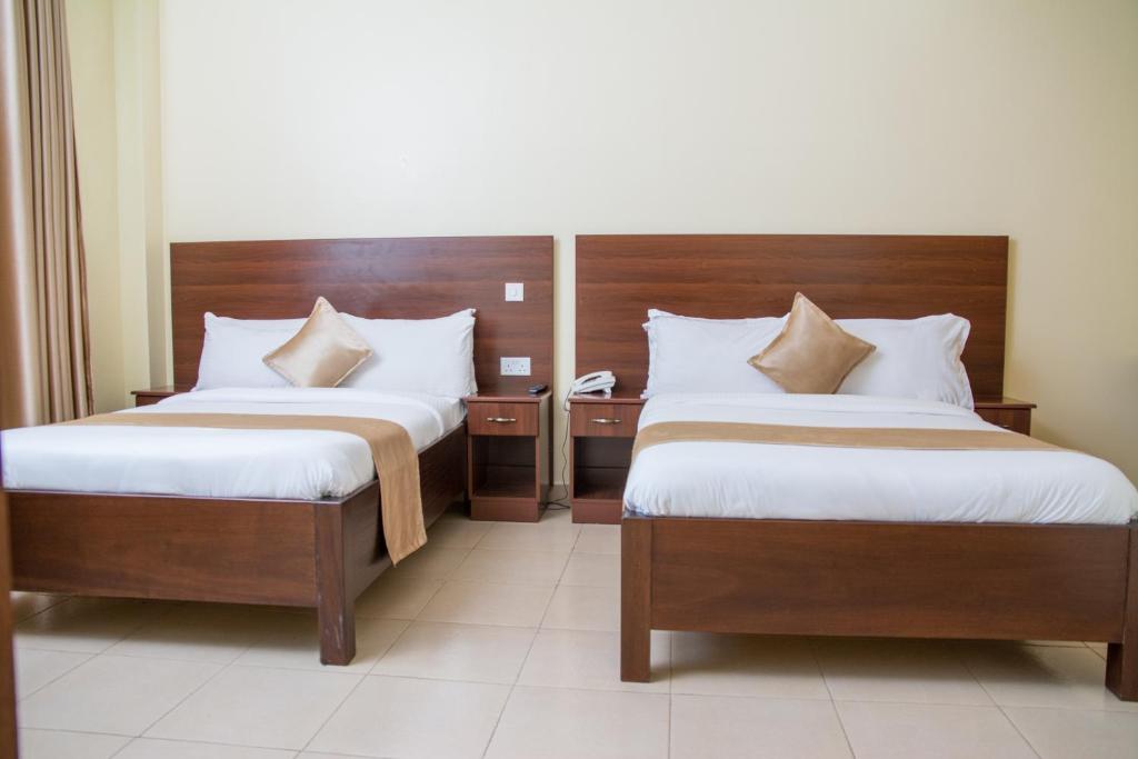 Postel nebo postele na pokoji v ubytování Delfirm Hotel