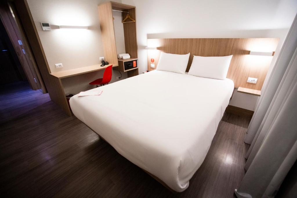 Postel nebo postele na pokoji v ubytování Hotel Moov Curitiba