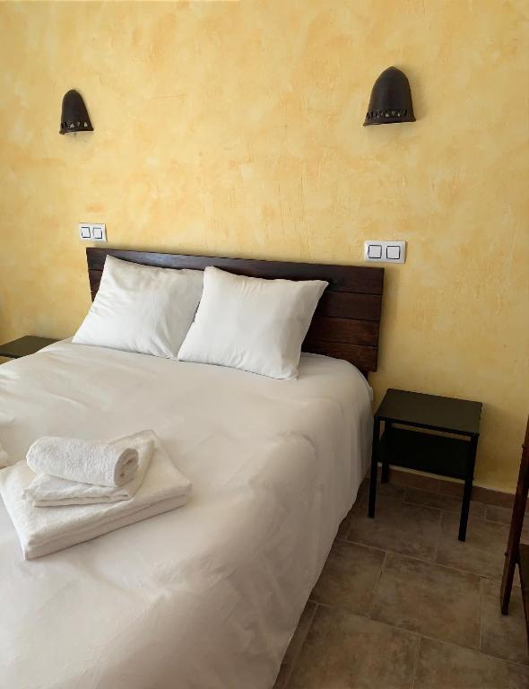 Postel nebo postele na pokoji v ubytování Casa Castillo