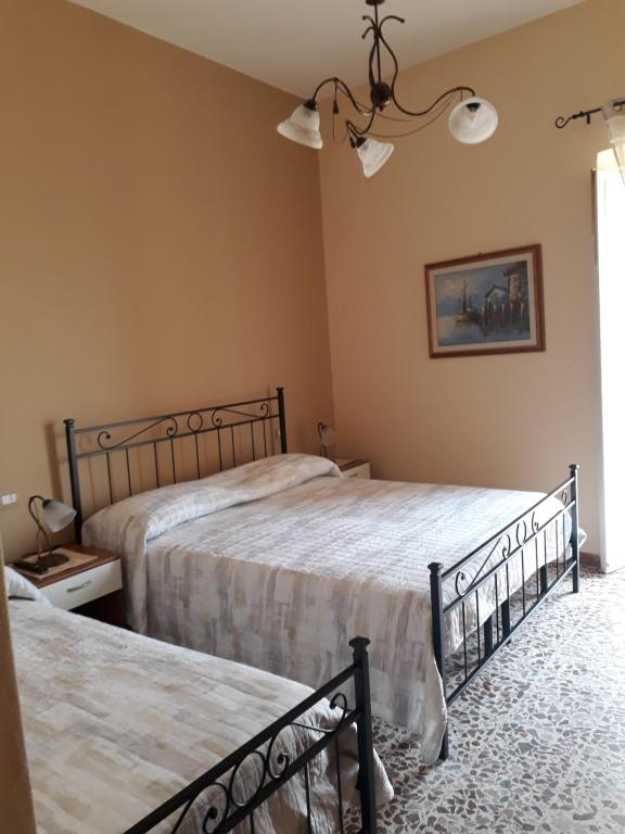 Posteľ alebo postele v izbe v ubytovaní L'Antico Faro
