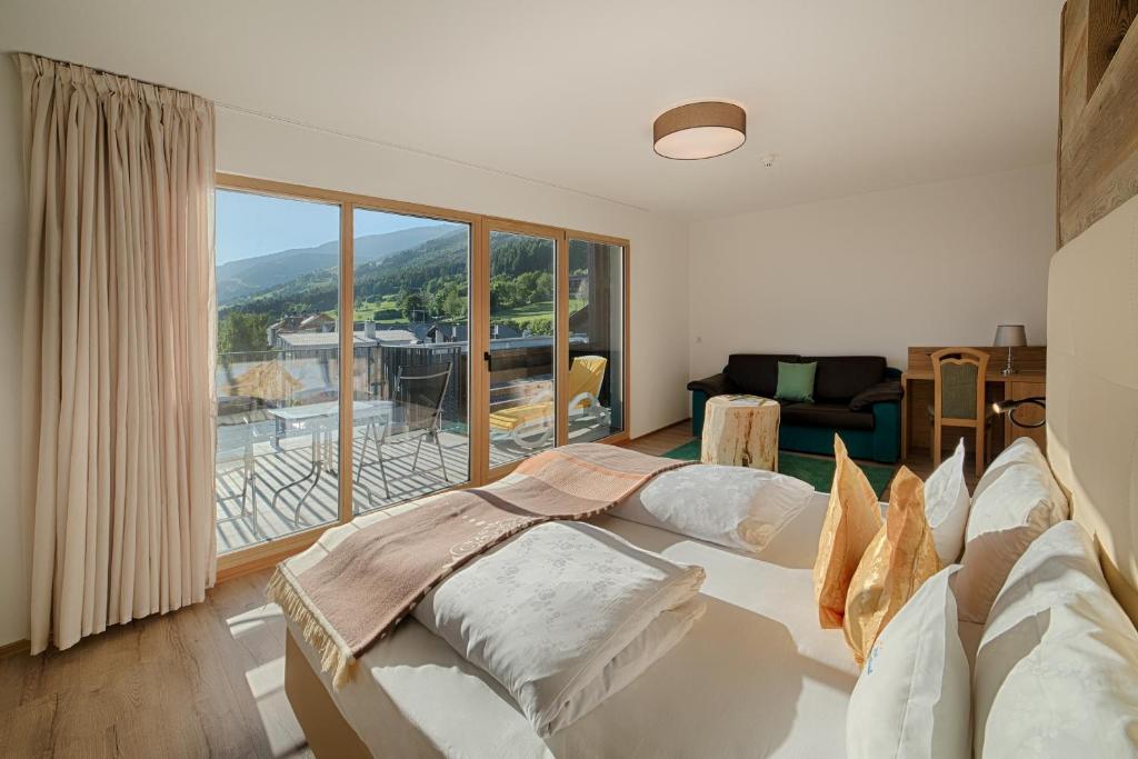 Postel nebo postele na pokoji v ubytování Hotel Kristall